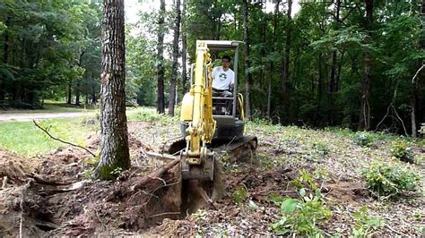 how to dig up stumps with mini excavator|tree stump removal with mini excavator.